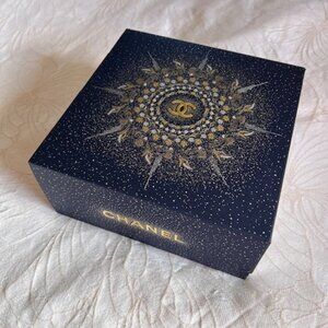 Limited edition Chanel gift box from the Holiday 2025 collection and gift pouch.